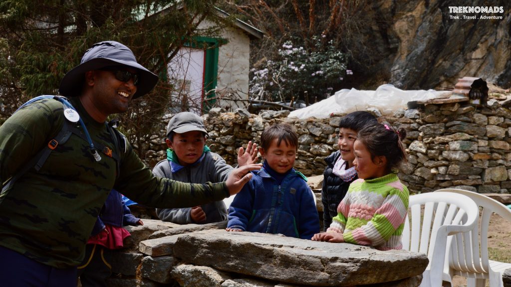 Namche Bazaar to Tyangboche is around 9 Kms trek. The altitude gain is from ~3,400 Meters to ~3,870 Meters. The trail is very beautiful and is surrounded by rhododendron trees. During spring season, the trail is laden with beautiful red and white flowers. The trail is a gentle hike for the first 1/3rd of the trail. The trail descends as we go further, till we reach a rope bridge. This is generally where we had our lunch. After the lunch, the trail suddenly starts ascending. The last part of the trail is very steep and tiring.