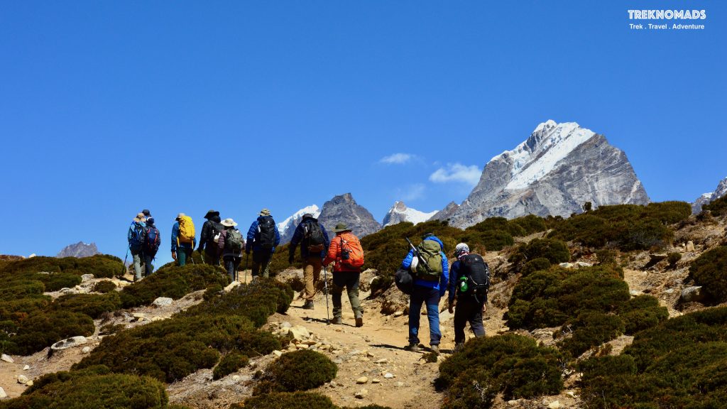 Trekkers walking. Hikers walking. Dingboche, Lobuche route. Cho yu