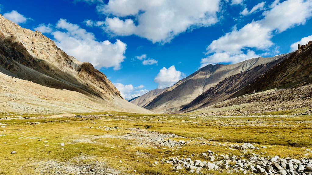 glacial stream, river, ice water, icy water, panaromic view, mountain, clouds, valley