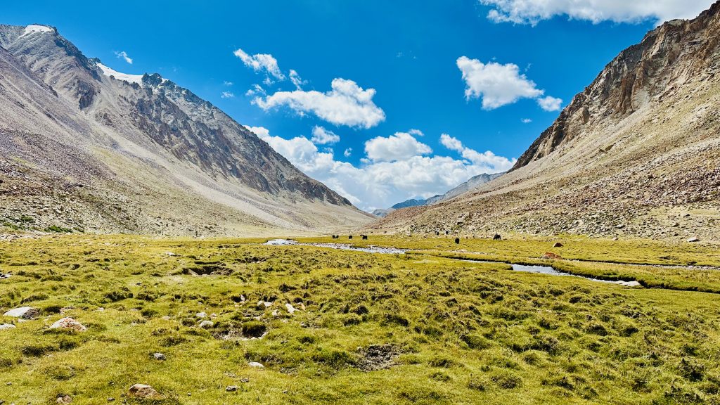 glacial stream, river, ice water, icy water, panaromic view, mountain, clouds, valley